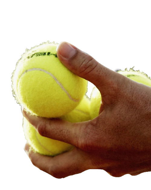 Cut out of tennis balls being held by a person